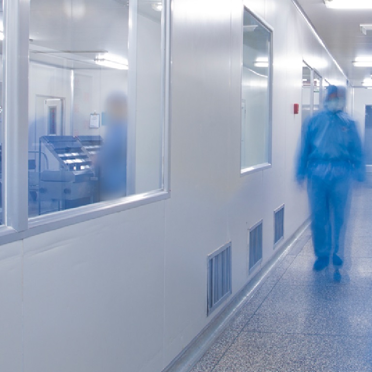 Hospital research lab and corridor with doctors in blue coveralls