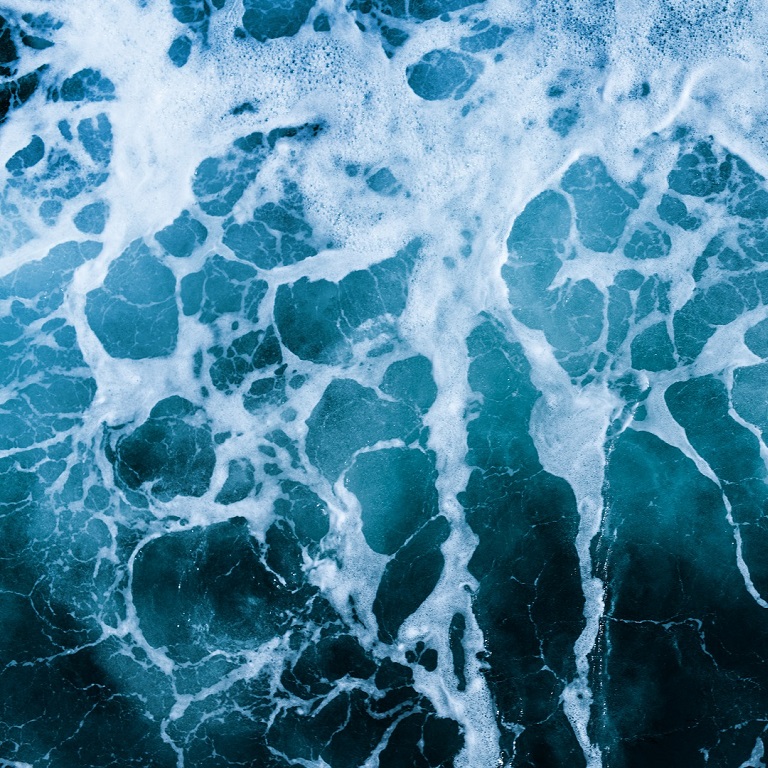 Crashing Waves of sea and Aerial view to ocean wave. Blue water background.